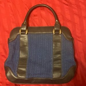 Handbag Black leather trim with blue woven material, zipper closure, 11x9x2”